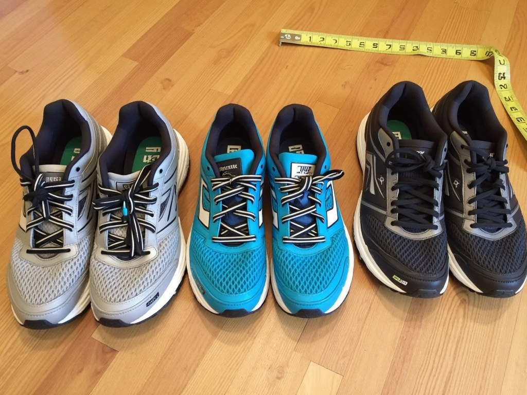 Worn running shoes showing different foot wear patterns